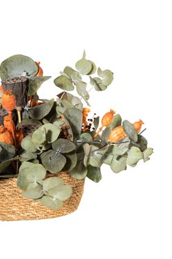 Alegre y otoñal centro de flores secas y preservadas en tonos naranja