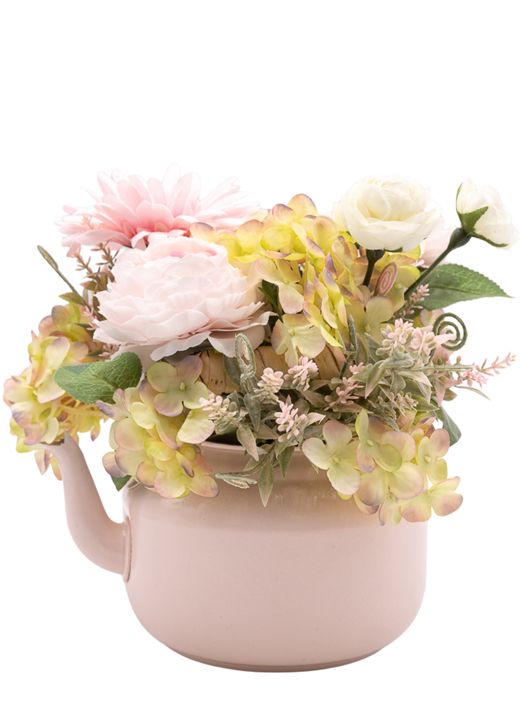 Dulce centro floral artificial en tonos rosa claros.