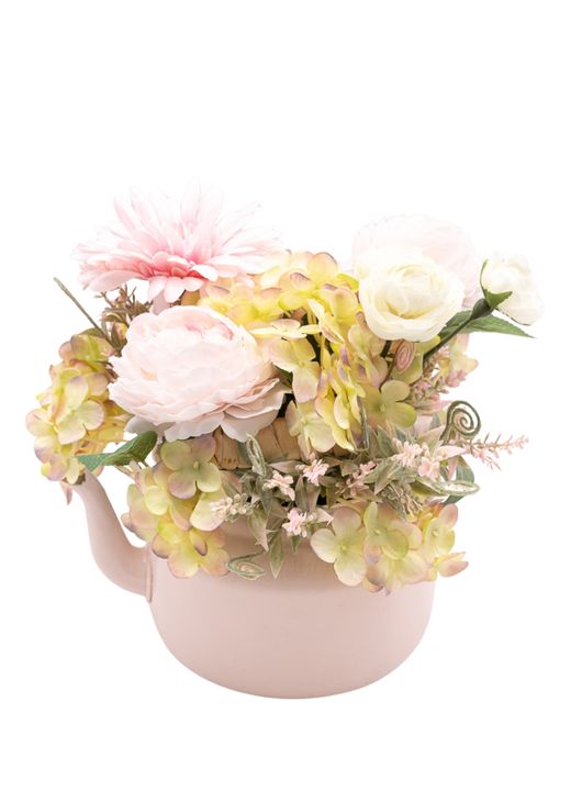 Dulce centro floral artificial en tonos rosa claros.