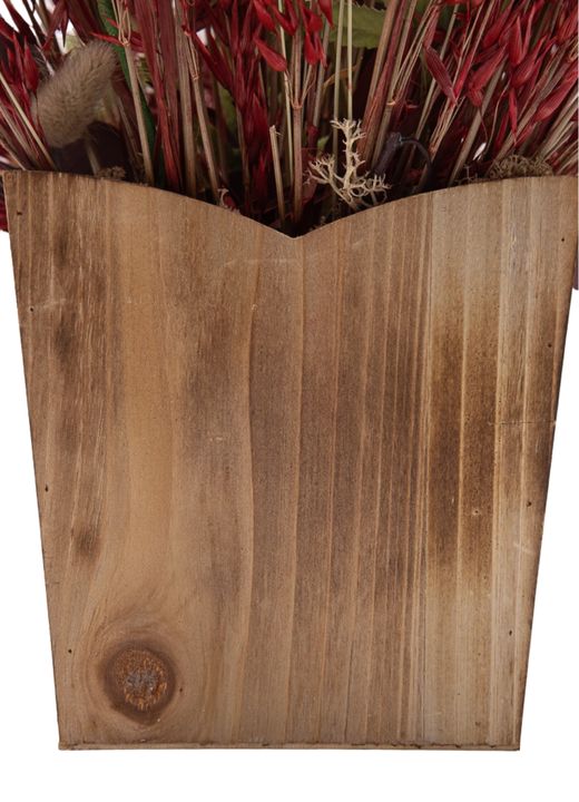 Encantador centro de flores artificiales y preservadas en tonos salmón y rojizos