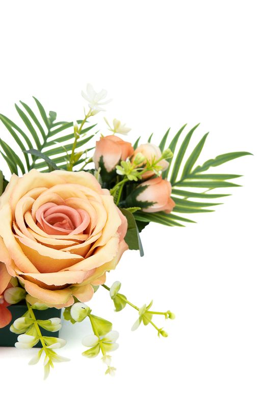 Pequeño centro floral de cementerio intenso en tonos naranjas