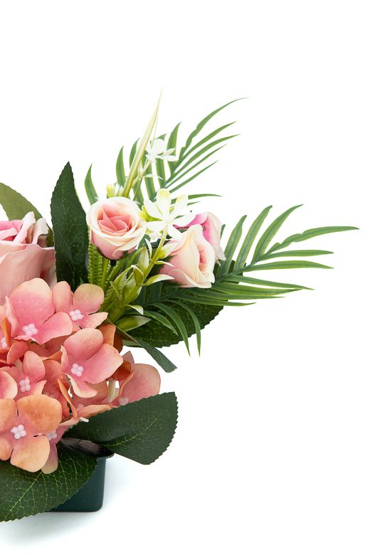 Sutil pequeño centro floral de cementerio en rosa y malva