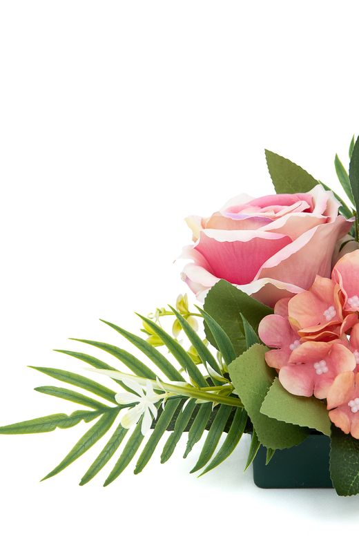 Sutil pequeño centro floral de cementerio en rosa y malva